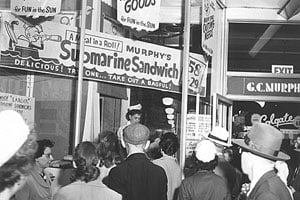 a group of people standing in front of a food stand at Market Square Place, Pittsburgh, PA, 15222