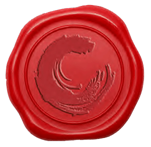 A red wax seal with a white design on it.