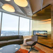 a living room with a couch a chair and a television