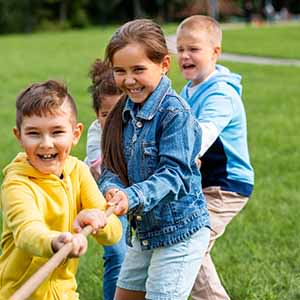 Kids playing tag a war at Solstice at Fiddyment Ranch, California