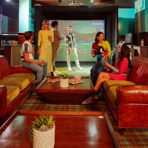 a group of people in a living room with a tv at Two Lincoln Tower Apartments, Bellevue, WA, 98004