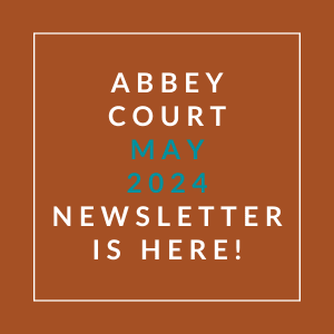 an orange background with the words abbey court may 2024 newsletter is here