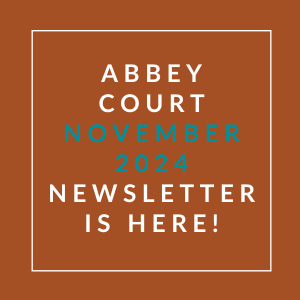 an aqua background with a white font with the words abbey court nove