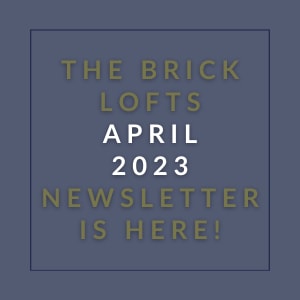 a sign that says the brick lofts april 23 newsletter is here