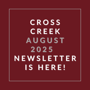 A red square with white text announcing the Cross Creek August 2025 newsletter.