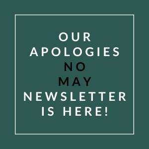 A sign that reads "Our Apologies No May Newsletter is Here!" is displayed.