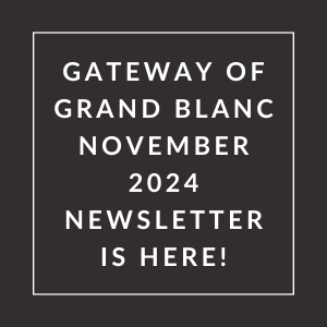 a white frame on a black background with the words gateway of grand blanc