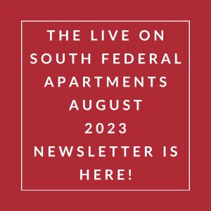 a red sign with a white border and the words the live on south federal apartments august