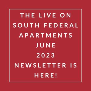 a red sign with a white border and the words the live on south federal apartments june
