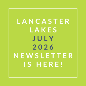 The image announces the availability of the Lancaster Lakes July 2026 newsletter.