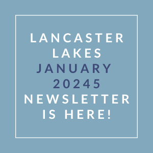 A blue square with white text announcing the Lancaster Lakes January 2024 Newsletter.