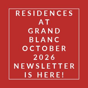 A red poster announcing the newsletter for Residences at Grand Blanc in October 2026.
