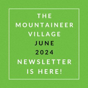 a green field with the words the mountaineer village june 2024 is here