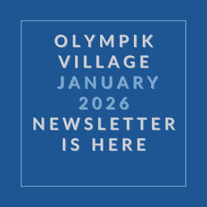 A blue square with white text that reads "Olympik Village January 2026 Newsletter is here".