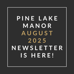 A black and gold sign announces the Pine Lake Manor August 2025 newsletter.