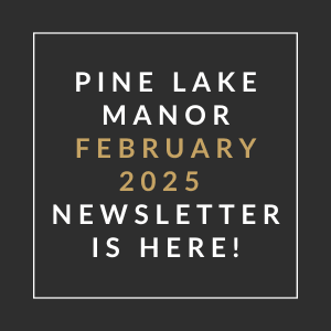 A black and gold sign that says "Pine Lake Manor January 2025 Newsletter is here!"
