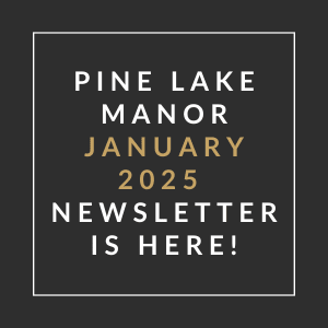 A black and gold sign that says "Pine Lake Manor January 2025 Newsletter is here!"