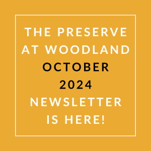 the white text on an orange background says the preserve at woodland october 24