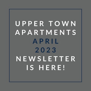 a gray background with a blue border and white text that reads upper town apartments april 23