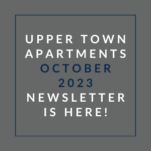 a gray background with a blue border and white text that reads upper town apartments october 23