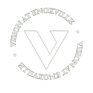 A logo with a white V in the middle and the words "Vision at Knoxville" surrounding it.