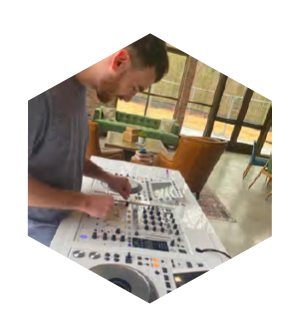 a man is working on an electronic device on a table