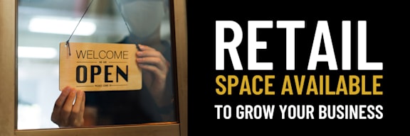 a man holding a bag with an open sign