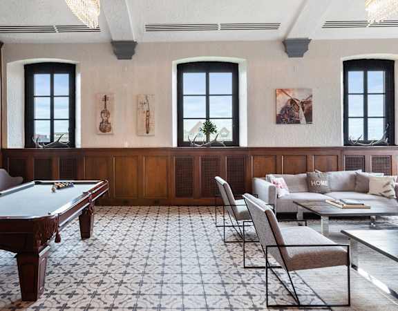 The Broderick billiards table and fireplace