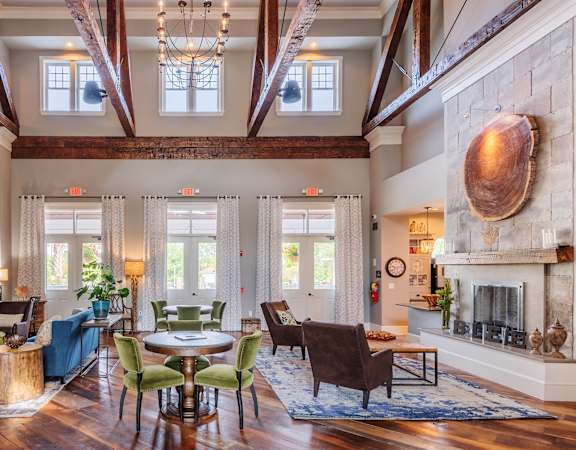 Windward Long Point Apartments - Clubhouse with fireplace and social area