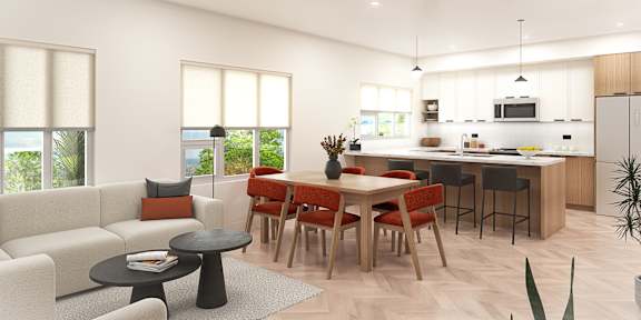A modern kitchen with a dining table and chairs.