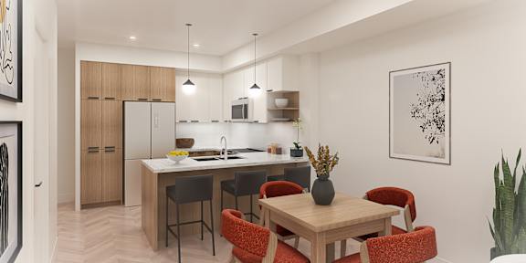 A modern kitchen with a dining table and chairs.
