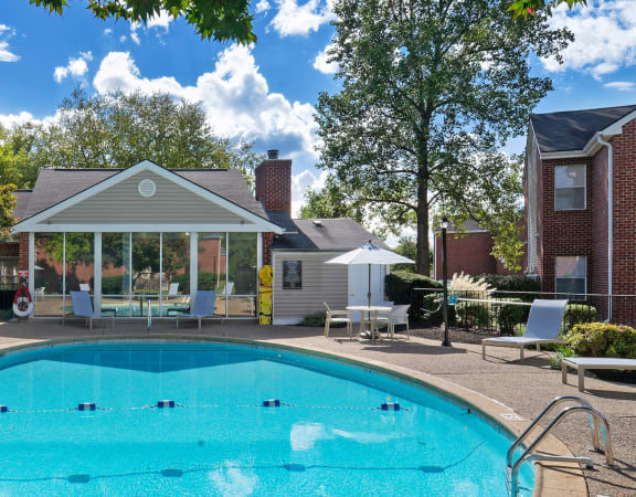 Swimming pool with ample lounge seating -East Chase Apartments