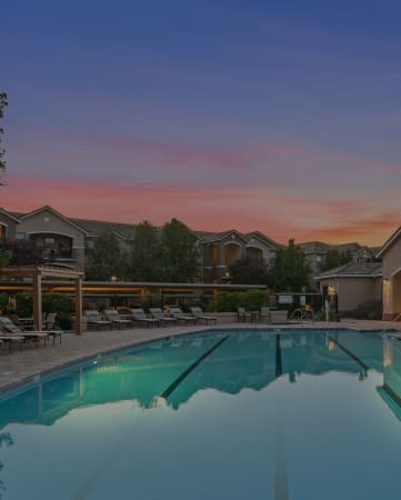Lighted pool at dusk - Mountain Shadows Apartments