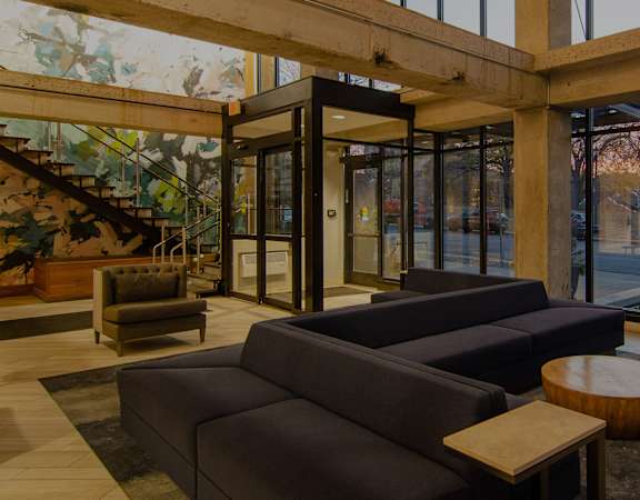 Resident clubhouse with window walls - Eitel Apartments