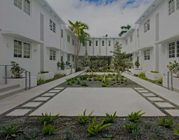 Courtyard with pathway - Helios Apartments