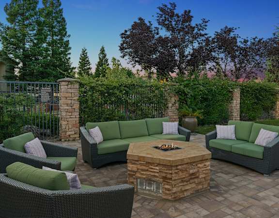 Outdoor fire pit lounge - Willow Springs Apartments