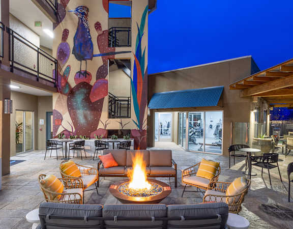 Fire pit near original mural by local artists - ABQ Uptown Apartments