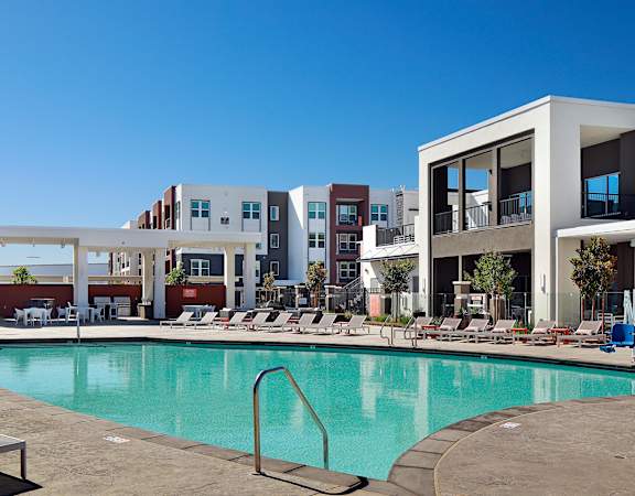 Resort-style swimming pool with large sun ledge - NOVA at Green Valley