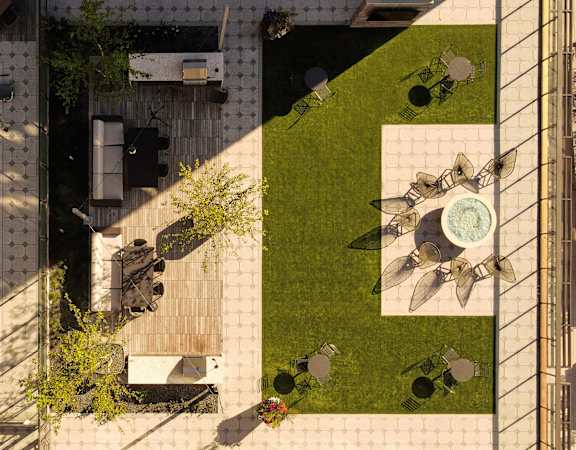 Birds eye view of the resort-style pool with ample seating - BLVD at Revere Beach
