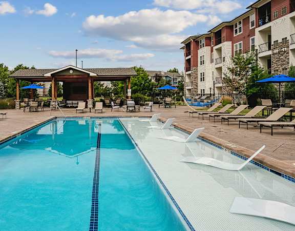 Resort-style saltwater swimming pool with sunning deck - Enclave at Cherry Creek