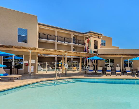 Resort-style swimming pool with pool-side cabanas - ABQ Uptown Apartments