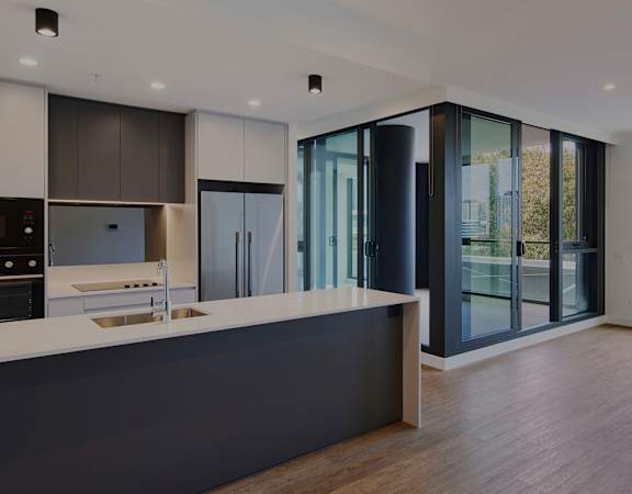 a kitchen with a large counter top and a large window