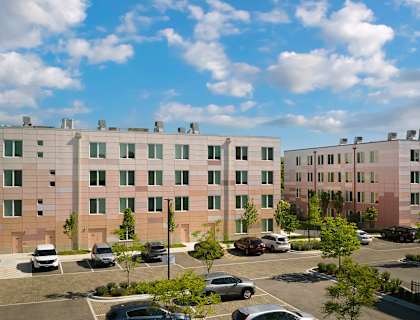 A large building with a parking lot in front of it.