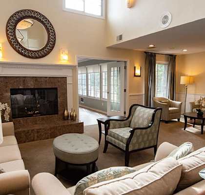 a living room with a fireplace and couches