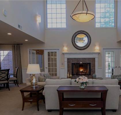 a living room with a couch and a fireplace