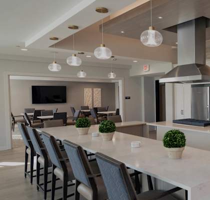 a large kitchen with a large island and a dining table