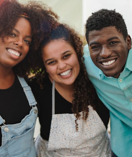 a group of people smiling and posing for a picture