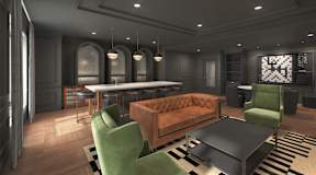 A modern living room with a brown sofa, green armchair, and a black coffee table.