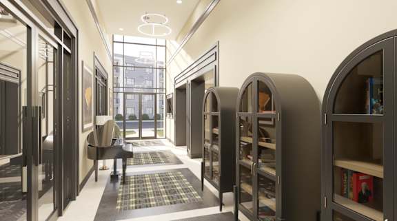 A library with bookshelves and a piano.