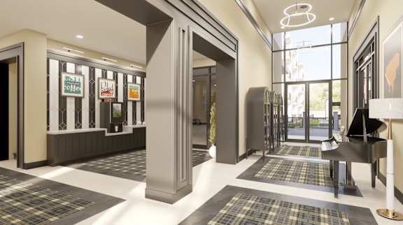A modern lobby with a black and white checkered floor.